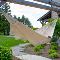 Ivory Double Brazilian Hammock with Fringe with a person