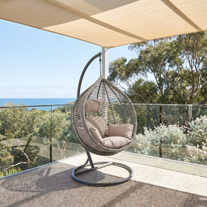 Outdoor hanging egg chair in woven PE wicker with a contemporary coastal design