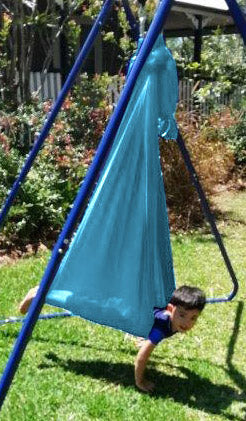 child playing in a Medium Teal Nylon Wrap Swing (450x180cm)