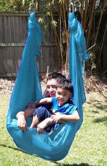 Medium Teal Nylon Wrap Swing (450x180cm) child with an adult